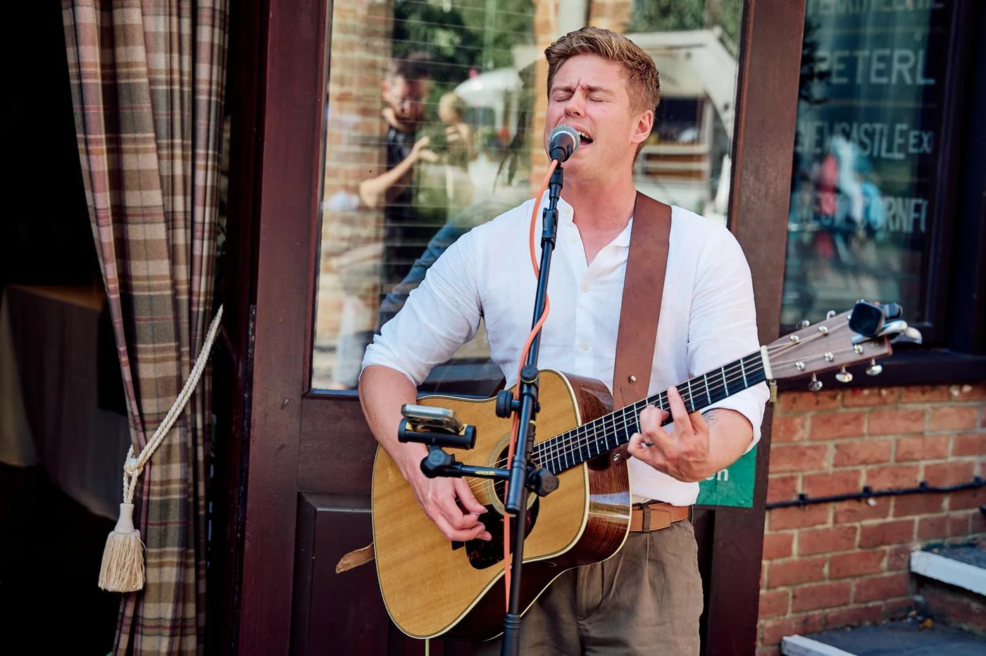 Jake singing with guitar