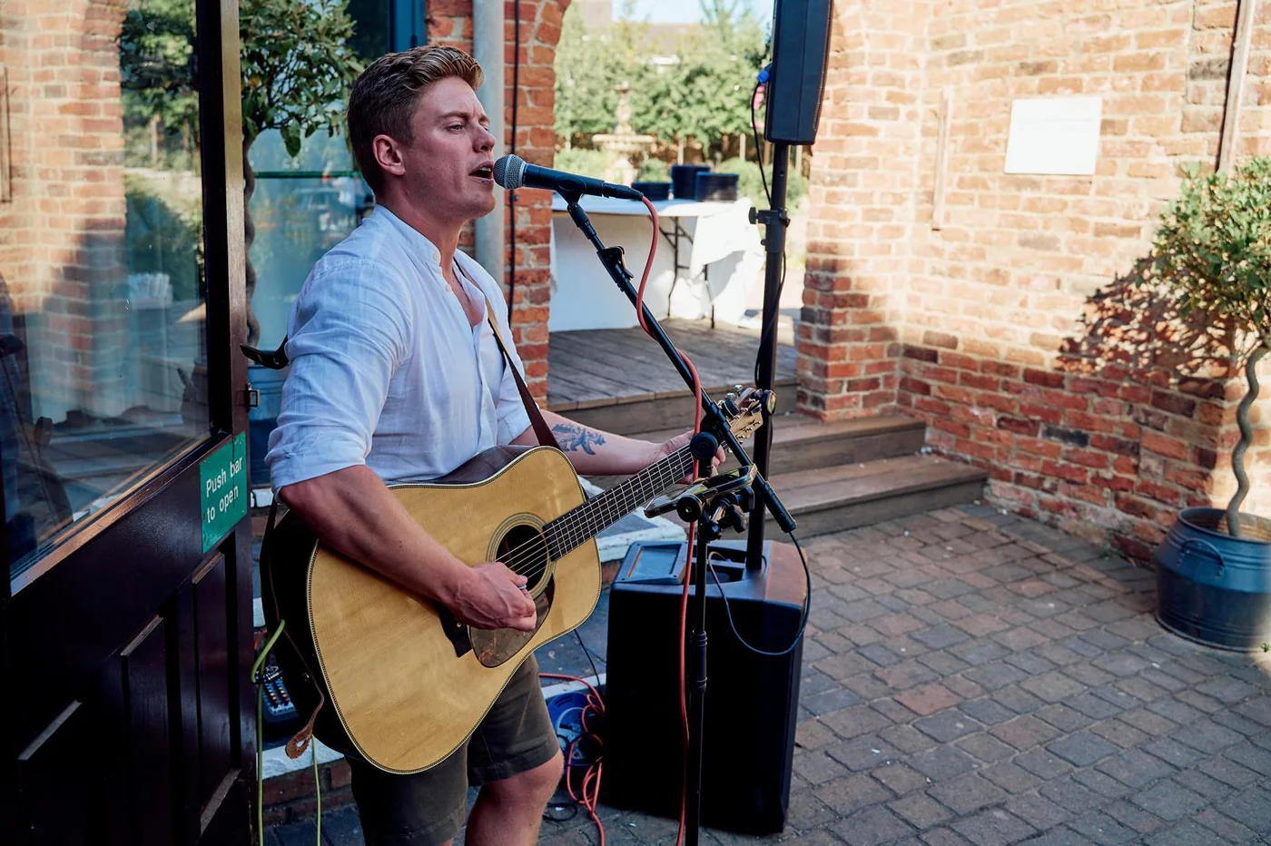 Jake Woodhams performing live with acoustic guitar