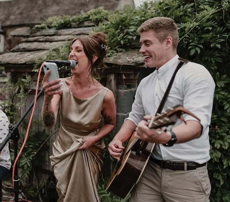 Jake performing with a wedding guest